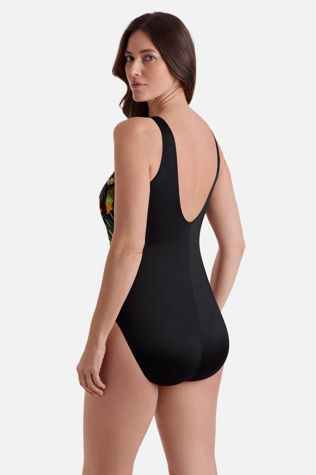 Woman turned left wearing a multicolor floral one-piece swimsuit