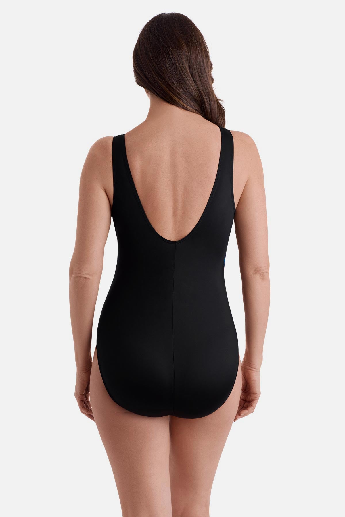 Woman turned away wearing a multicolored abstract printed one-piece swimsuit