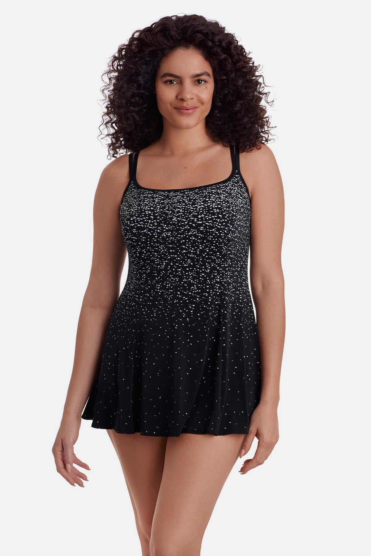 Woman wearing a black and white speckled swim dress