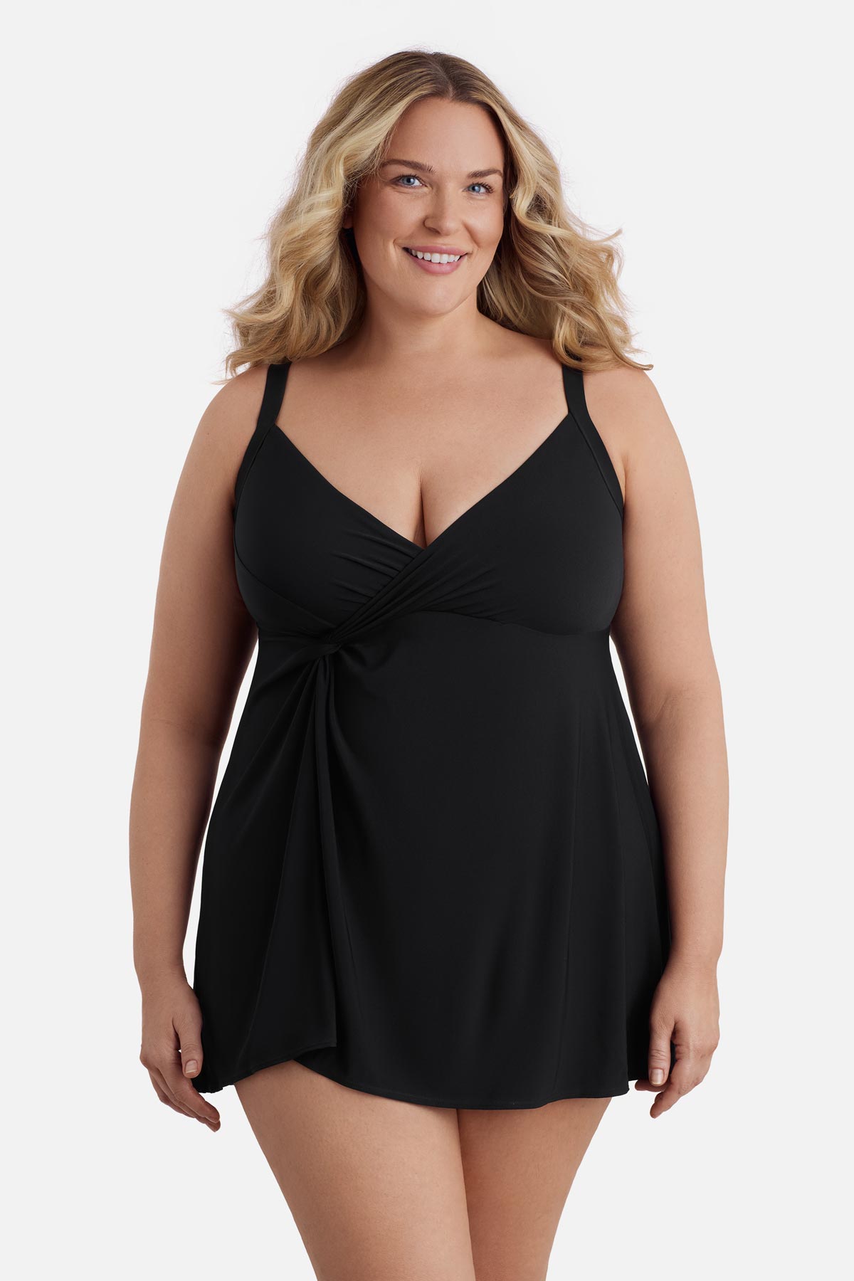Woman wearing a black swim dress with a v neckline