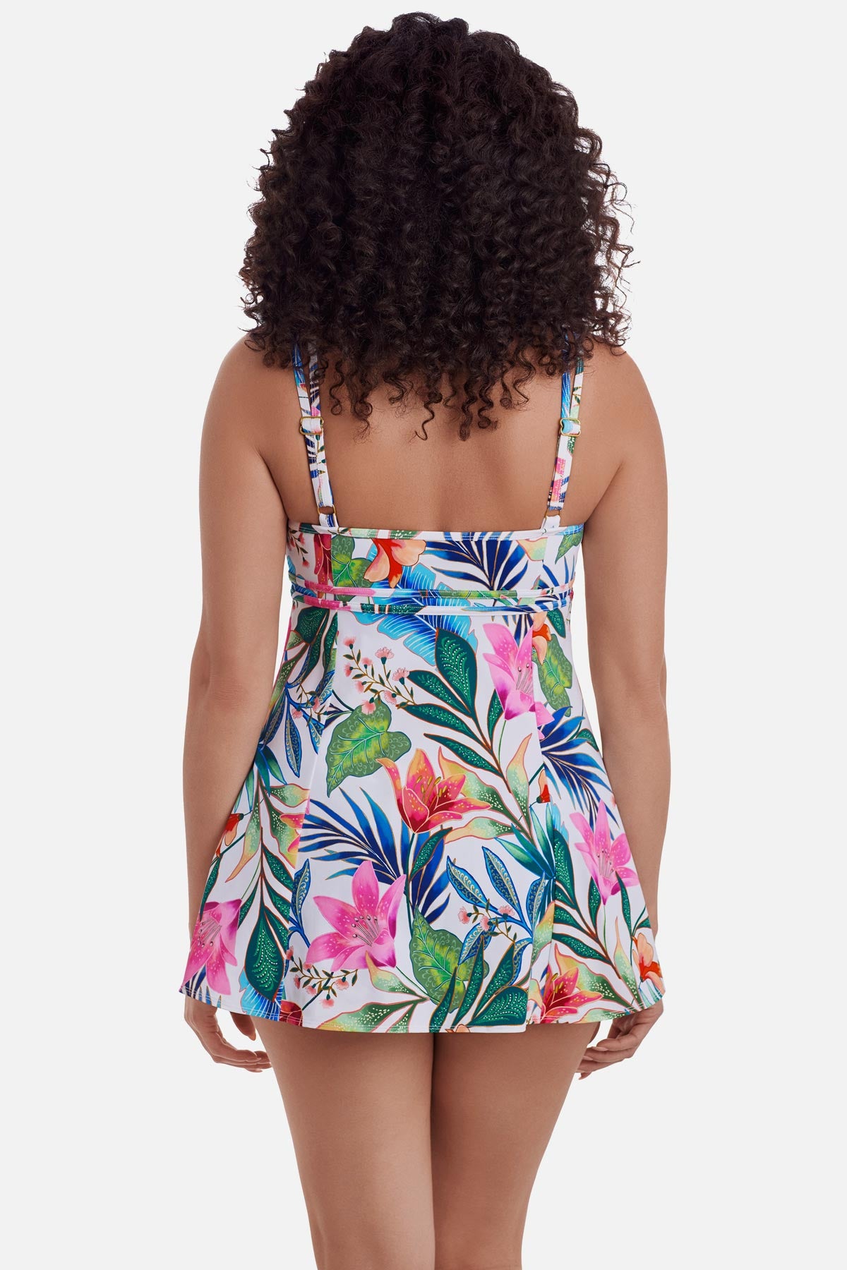 Woman turned away wearing a multicolored floral printed swim dress