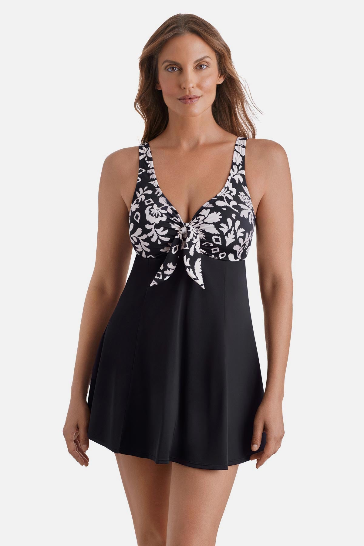 Woman wearing a black and white palm tree printed swim dress