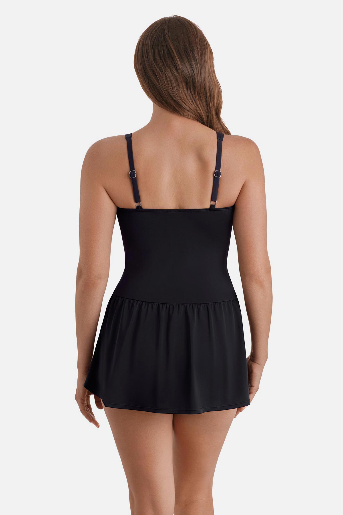 Woman turned away wearing a black, blue and white floral printed skater swim dress with black skirted bottom