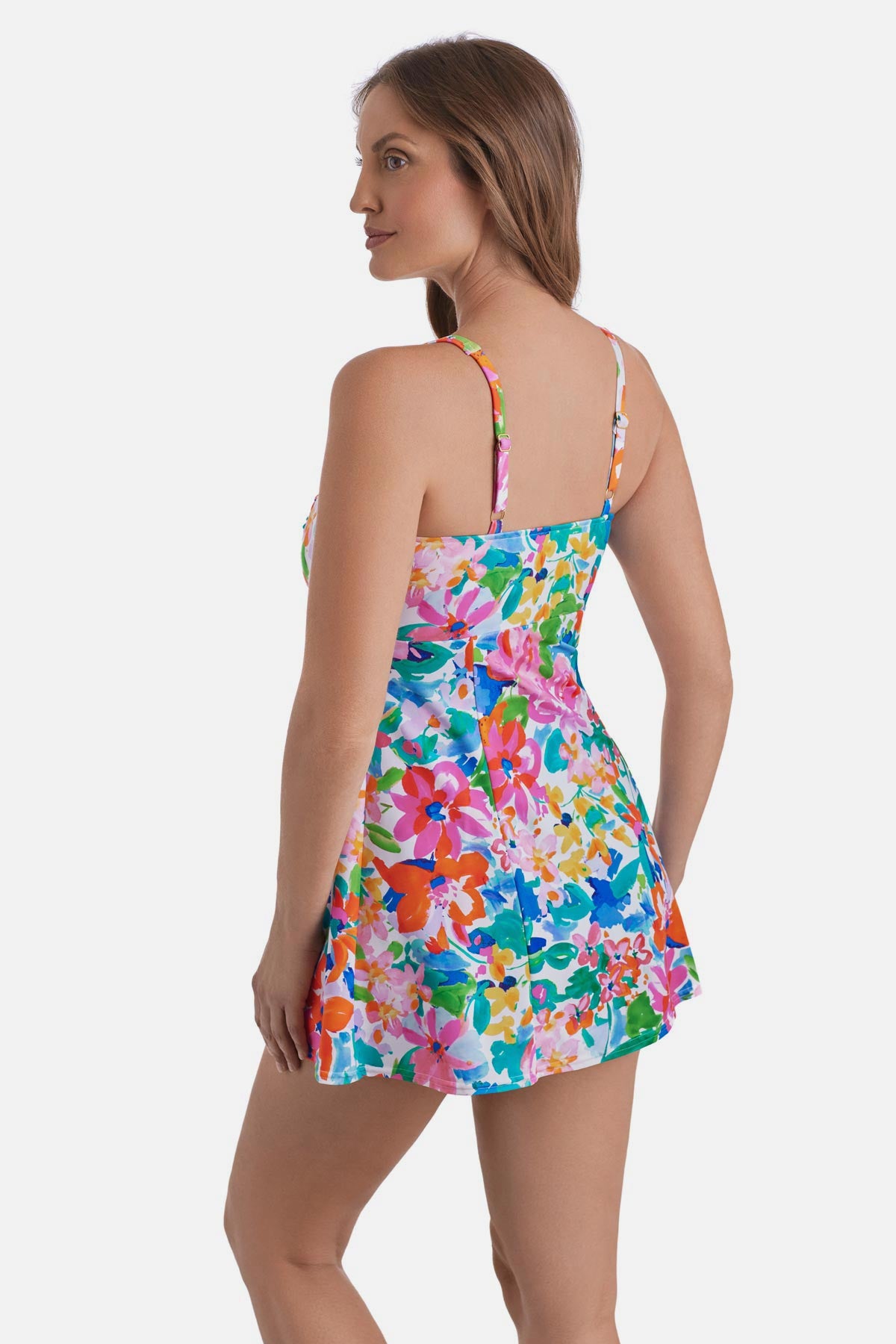 Woman turned left wearing a multicolored floral print square neck swim dress