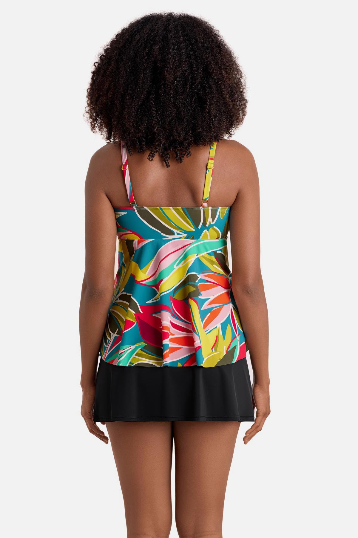 Woman turned away wearing a multicolored abstract printed tankini top
