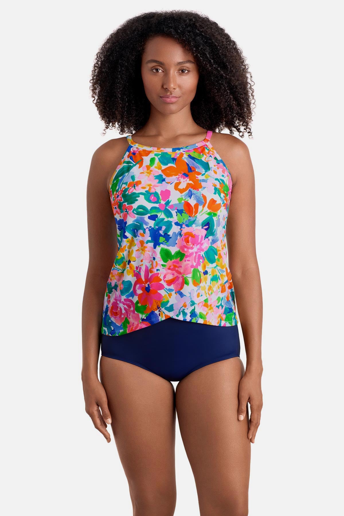 Woman wearing a multicolored floral printed high neck tankini top