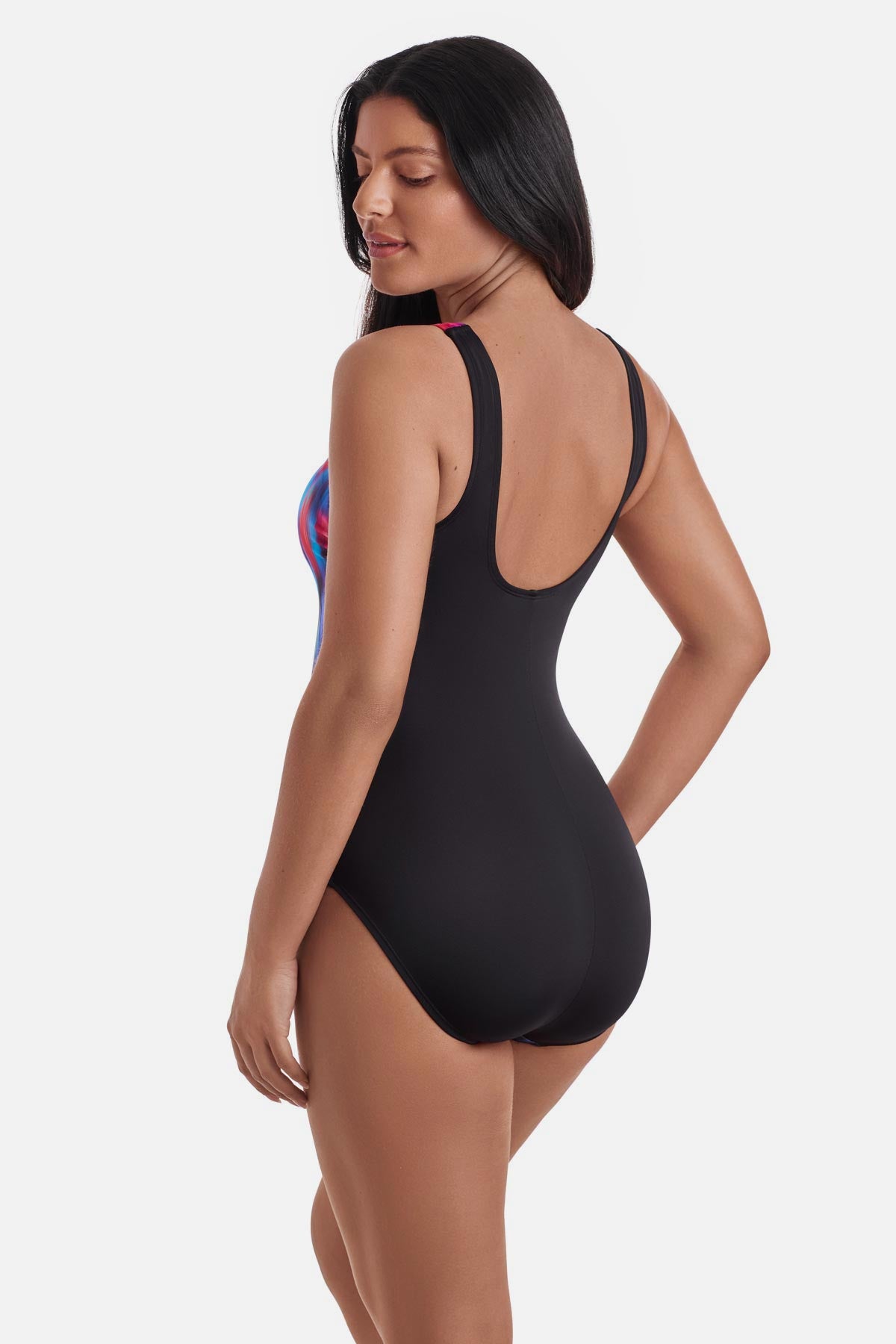 Woman turned left wearing a multicolored tie die one-piece swimsuit