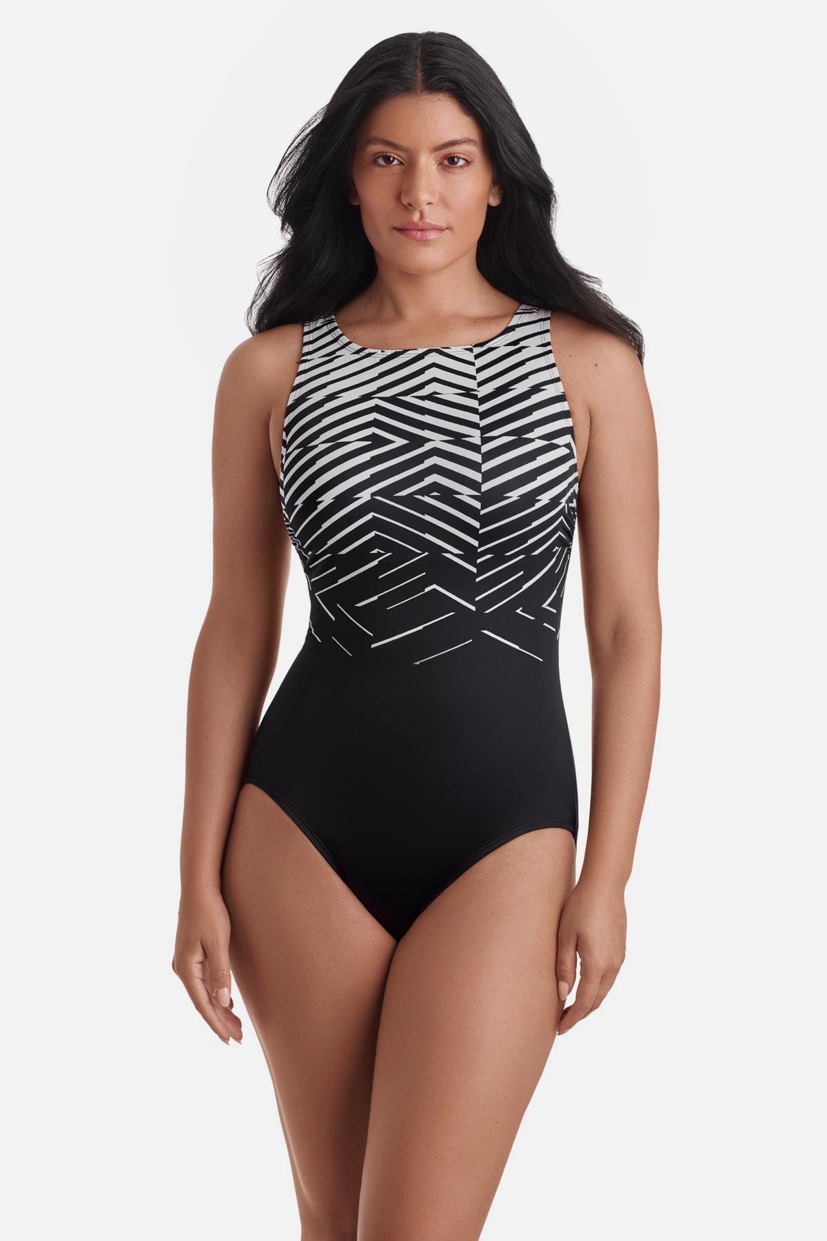 Woman wearing a black and white abstract pattern one-piece swimsuit
