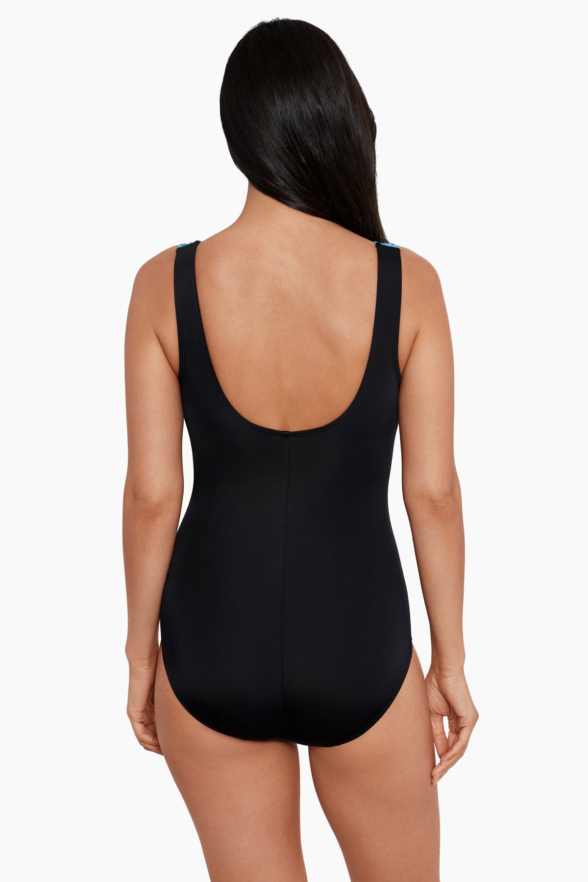 Woman faced away wearing a one-piece swimsuit