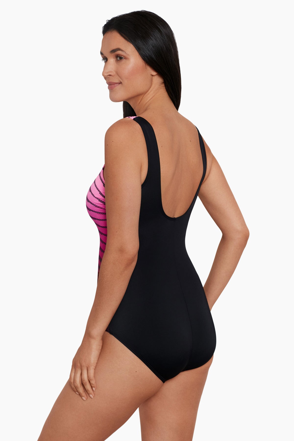 Woman faced left wearing a pink ombre zig zag pattern one-piece swimsuit