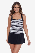 Woman wearing a black and white tie dye skater swim dress