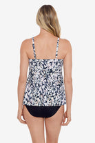 Woman faced away wearing a leopard printed tankini top