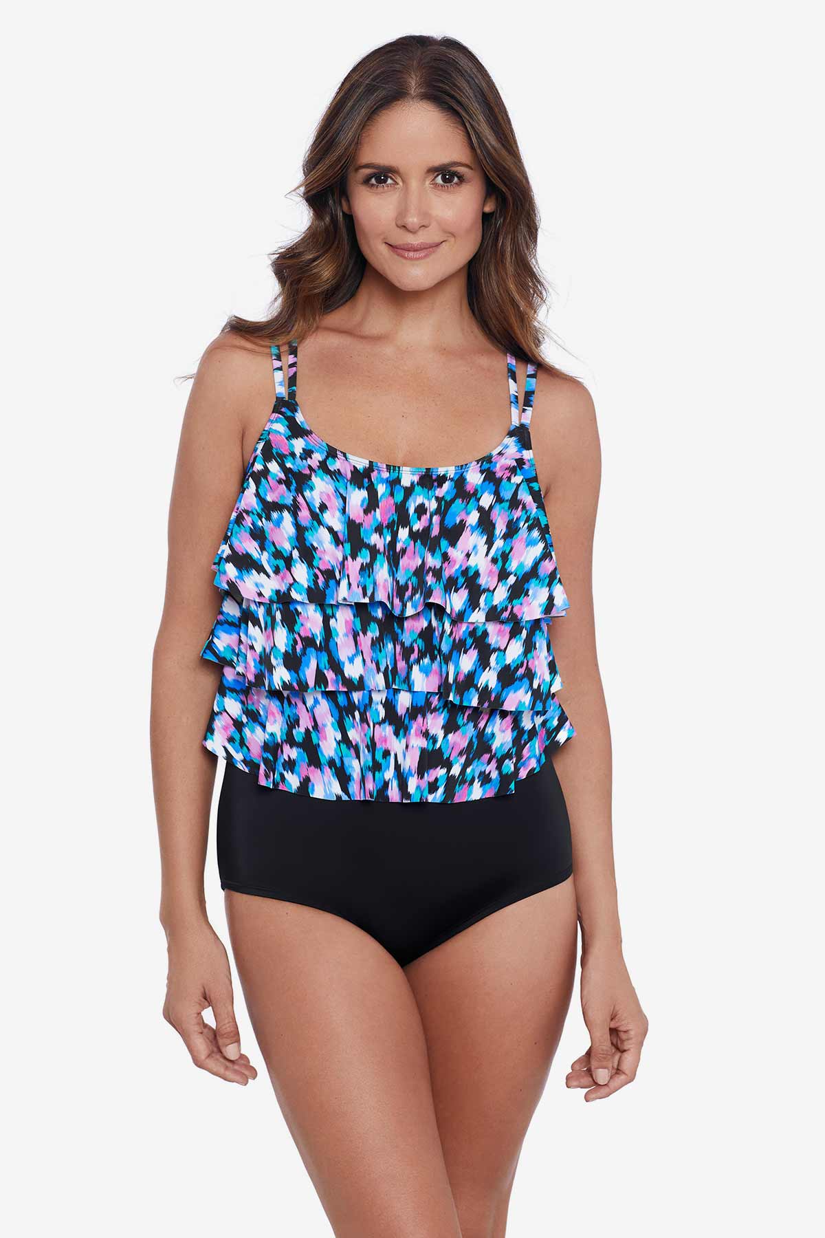 Woman wearing a multicolored abstract printed tiered tankini top