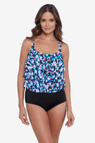 Woman wearing a multicolored abstract printed tiered tankini top