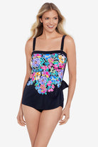 Woman wearing a multicolored floral printed sarong one-piece swimsuit