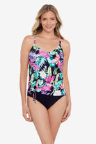 Woman wearing a multicolored tropical printed side ring tankini top