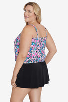 Woman turned left wearing a multicolored floral printed blouson tankini top