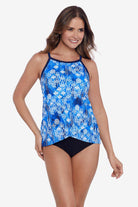 Woman wearing a blue and white abstract pattern flowy high neck tankini top