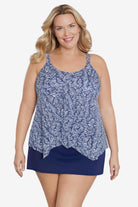 Woman wearing a blue and white abstract pattern tankini top