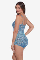 Woman turned left wearing a blue tile pattern one-piece swimsuit 