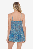 Woman faced away wearing a blue tile pattern swim dress