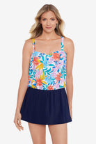 Woman wearing a multicolored tropical print blouson swim dress