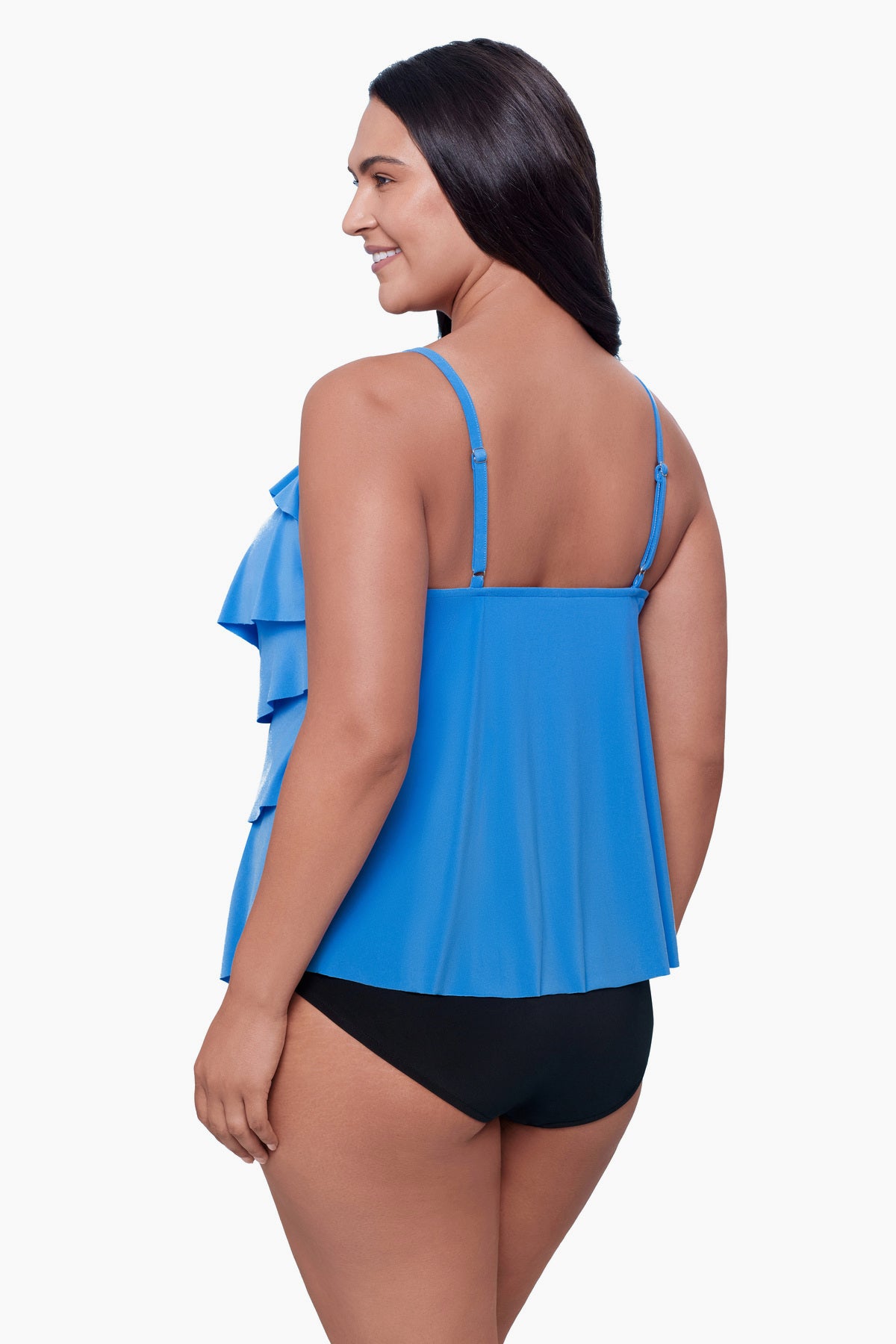 Woman turned left wearing a tiered tankini top in light blue