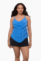 Woman wearing a tiered tankini top in light blue
