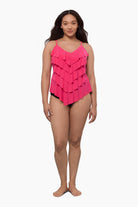 Woman wearing a tiered tankini top in rose pink