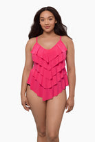 Woman wearing a tiered tankini top in rose pink