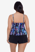Woman faced away wearing an abstract snakeskin printed swim romper