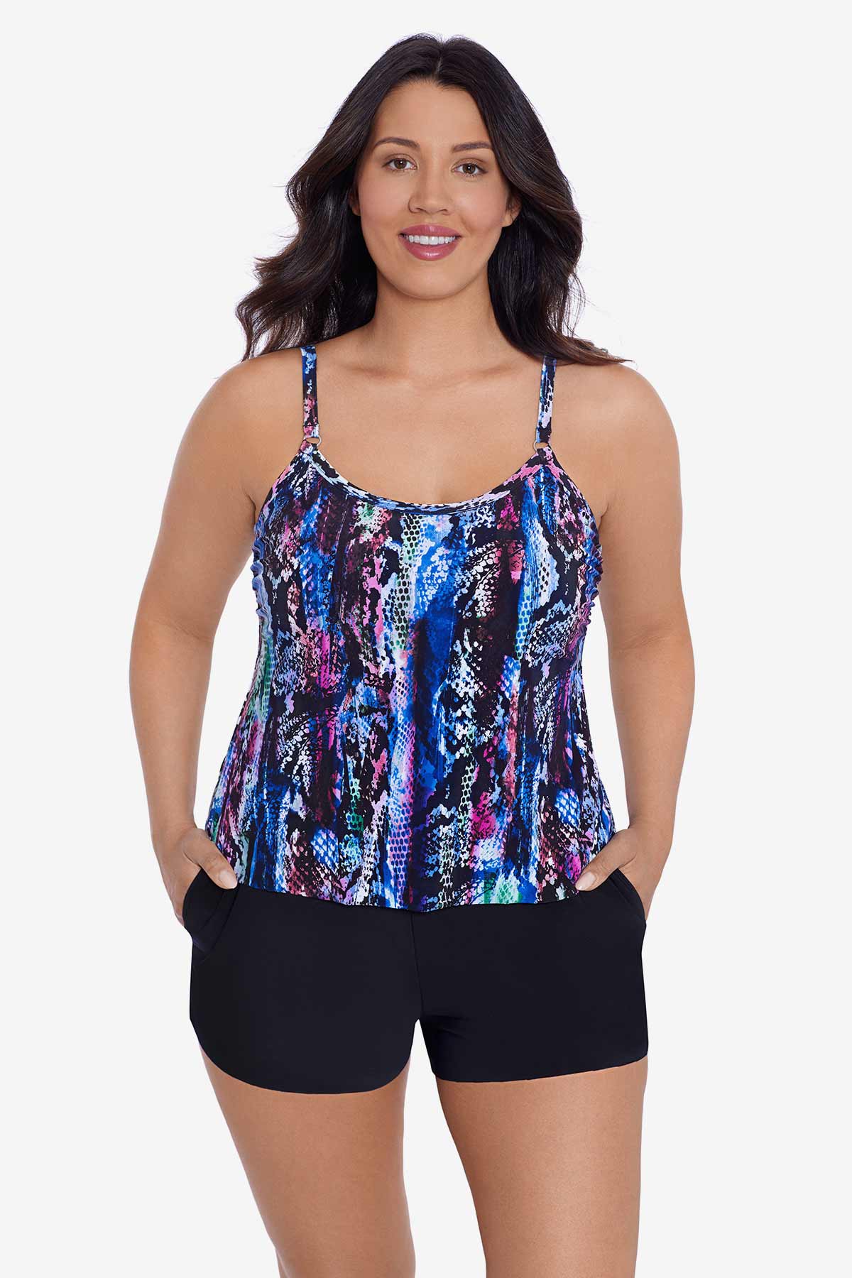 Woman wearing an abstract snakeskin printed swim romper with pockets