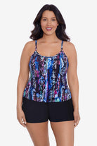 Woman wearing an abstract snakeskin printed swim romper