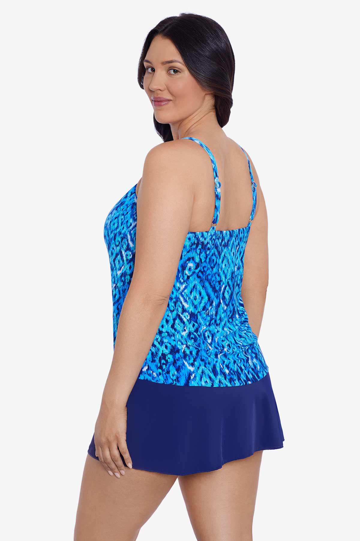 Woman faced left wearing a blue diamond printed tankini top