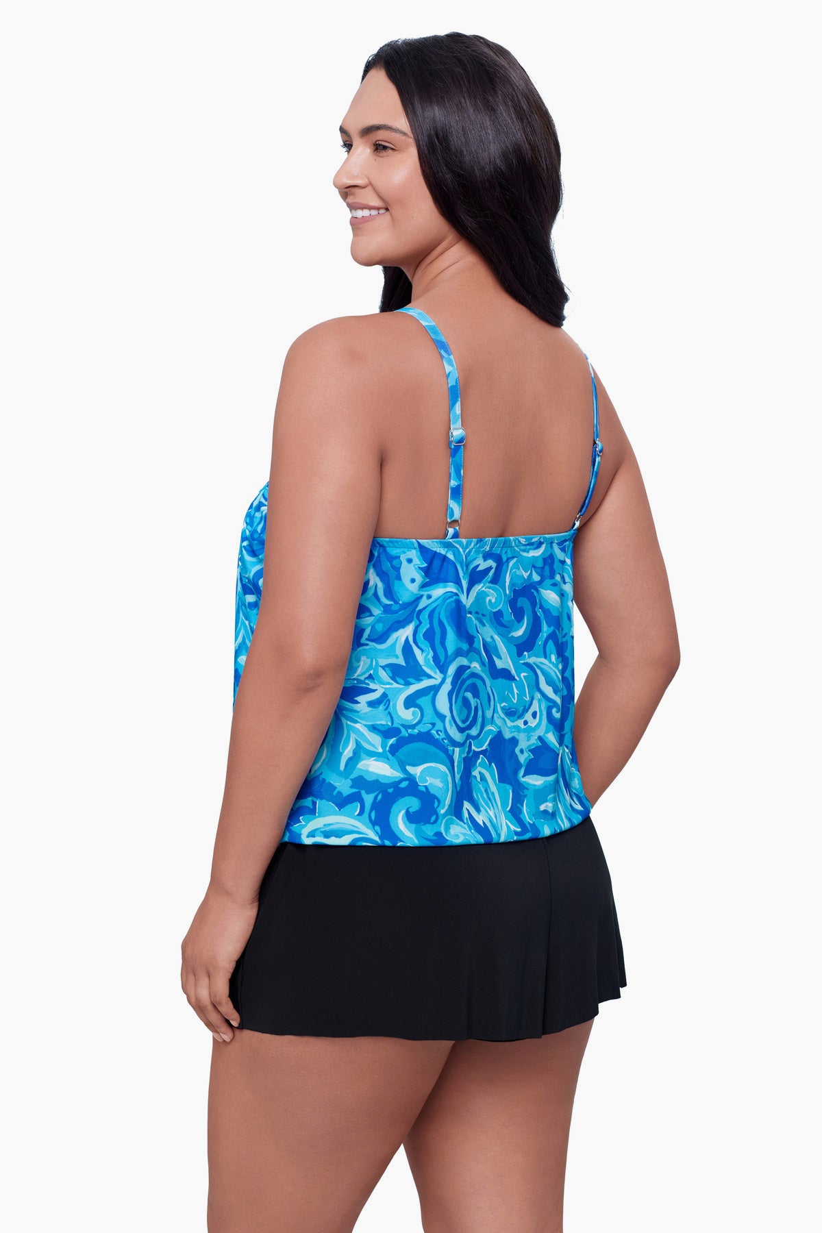 Woman turned left wearing a swim romper with a blue abstract print