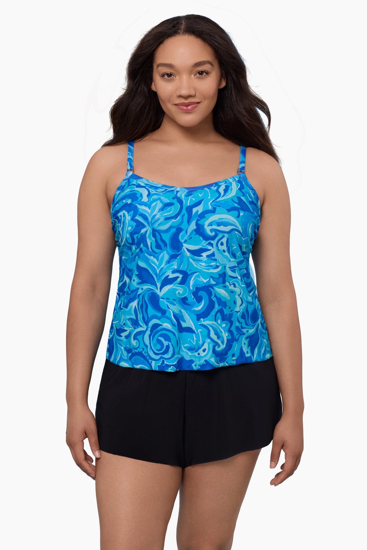 Woman wearing a swim romper with an abstract blue print