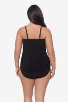 Woman faced away wearing a pink and orange floral printed tankini top