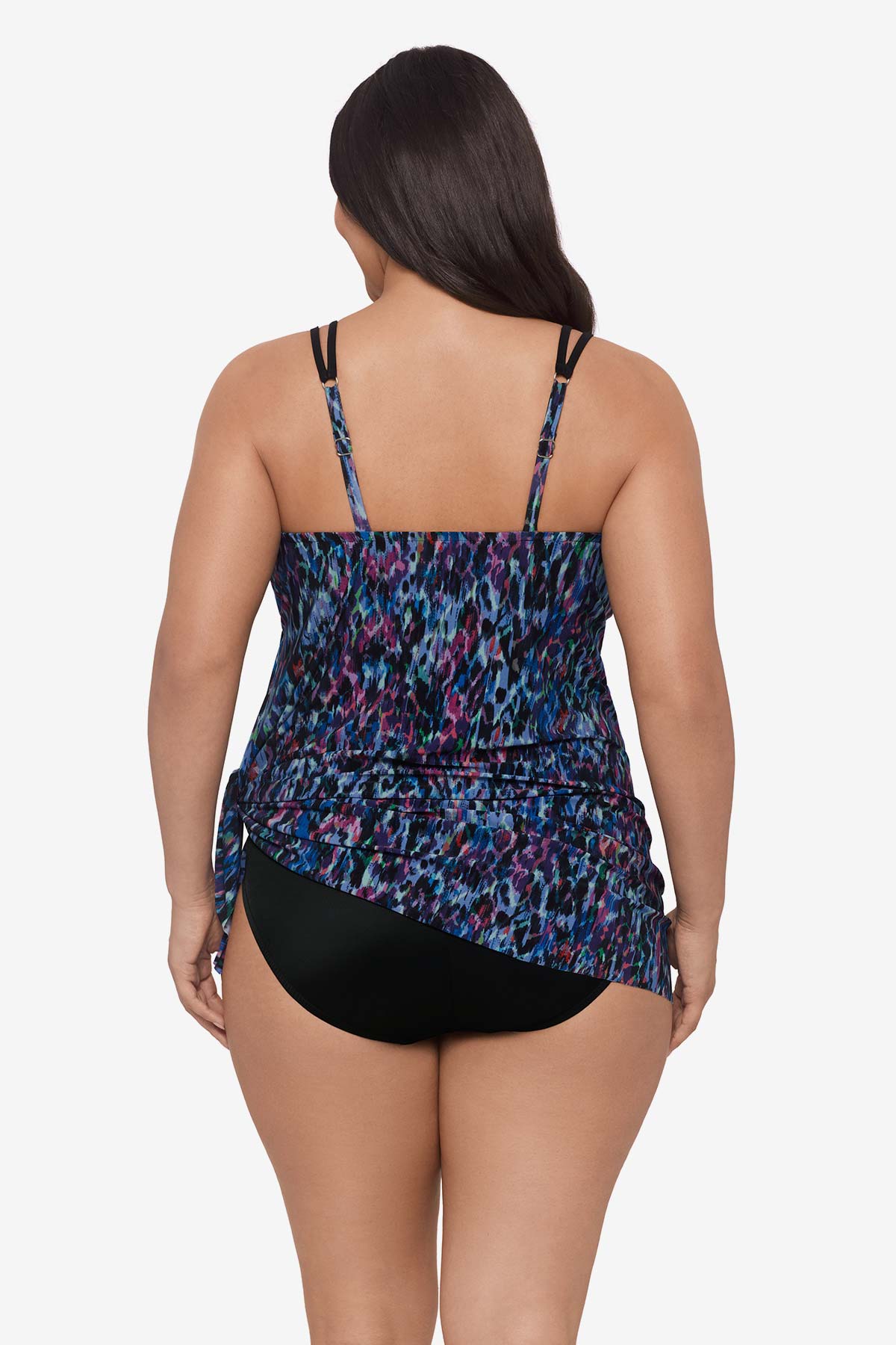 Woman faced away wearing a blue and purple abstract printed swim dress