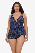 Woman wearing a blue and purple abstract printed swim dress