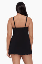 Woman turned away wearing a swim dress 