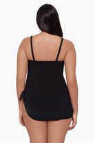 Woman faced away wearing a swim dress 