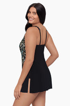 Woman turned left wearing a swim dress with an ombre leopard print