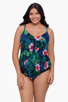 Woman wearing a tankini top with a floral pattern