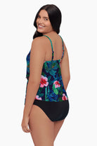 Woman turned left wearing a tankini top with a floral pattern