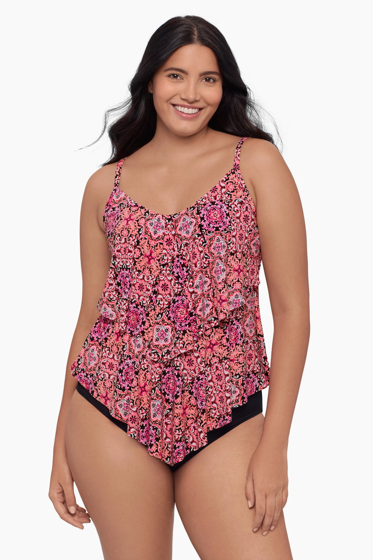 Woman wearing a tiered tankini top with a pink tile pattern