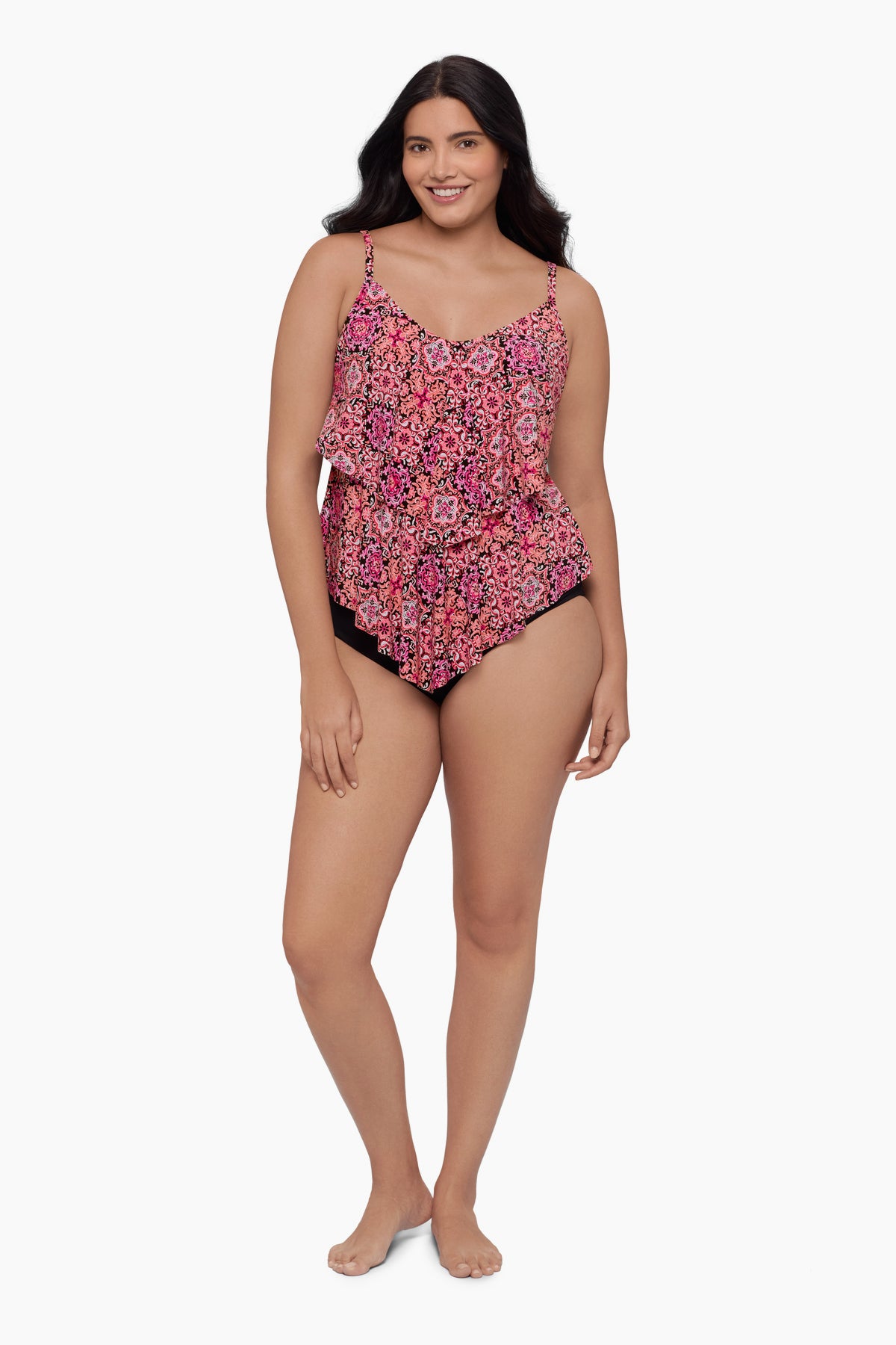 Woman wearing a tiered tankini top with a pink tile pattern