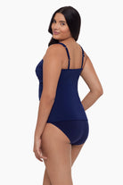 Woman turned left wearing a tankini top in ink blue