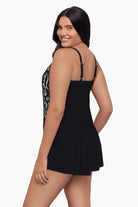 Woman turned left wearing a tankini top with an ombre leopard print