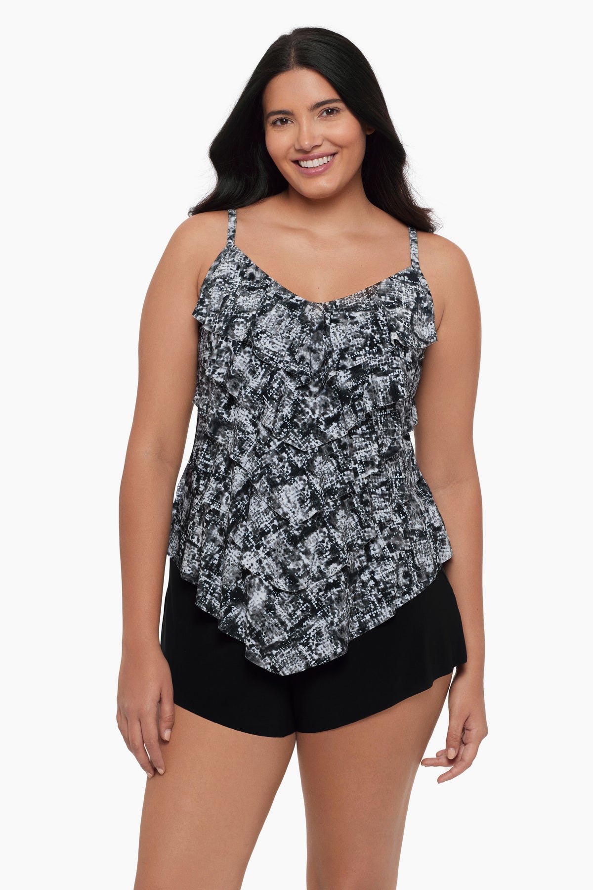 Woman wearing a tiered tankini top with a black and white print