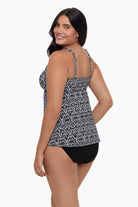 Woman turned left wearing a tankini top with a black and white pattern